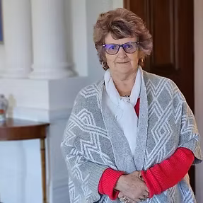 Rose, founder and owner of Capital Shuttles, smiling in Wellington